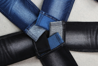 پارچه جناغی جین کشدار پود رنگی 59 اینچی با رنگ مخلوط سیاه آبی سفید در پشت